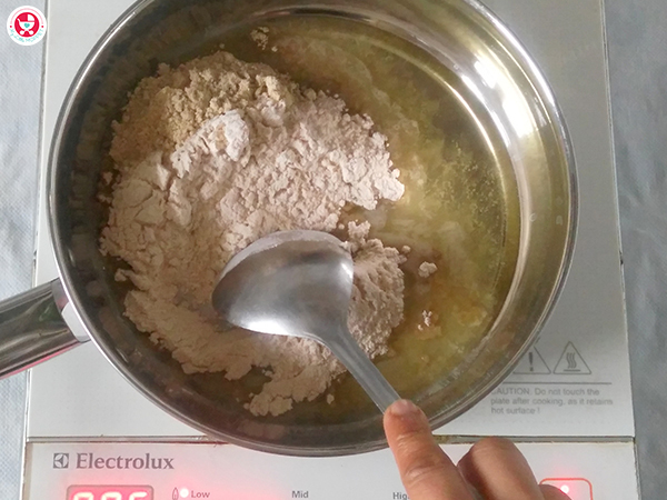 adding sathumaavu and wheat flour
