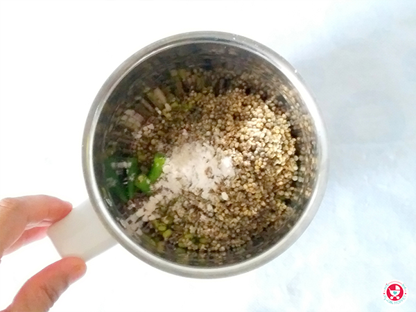Add soaked and drained green gram and pearl millet in a grinder jar