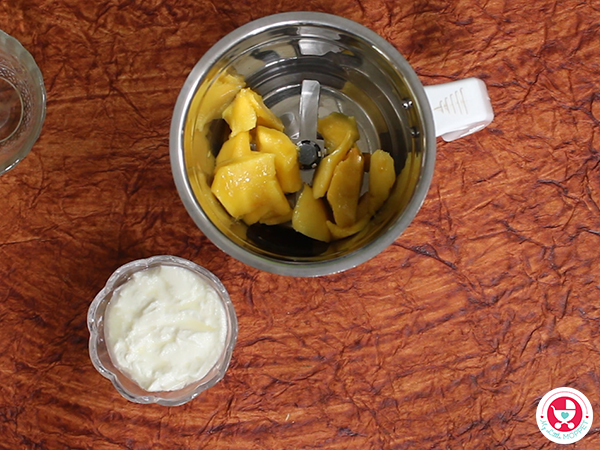 Blend the peeled mango pieces