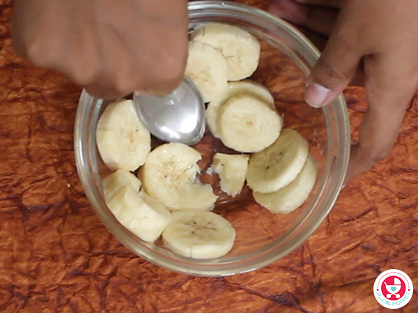  Mash banana with spoon 