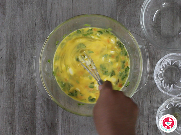add eggs, cheese, carrot, coriander, milk and whisk well.
