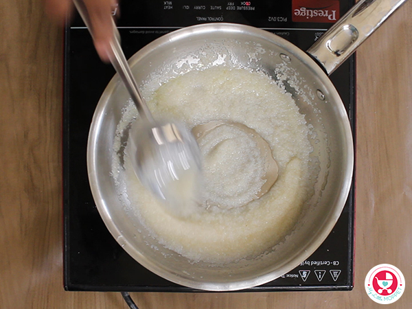Add water slowly and keep stirring till the mixture thickens.