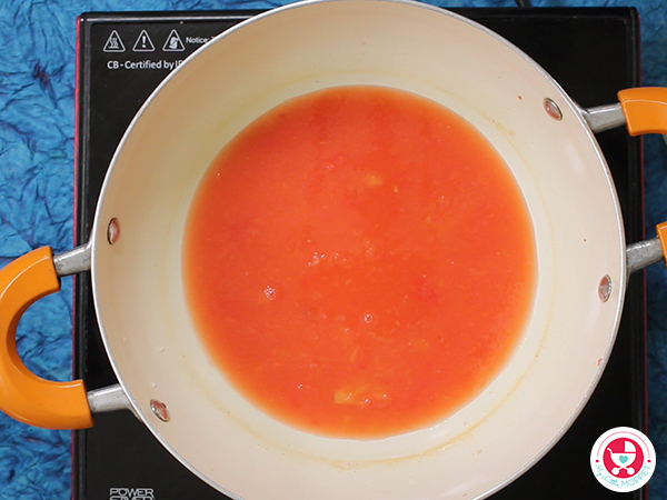 In a pan, add tomato puree and cook for 2 minutes.