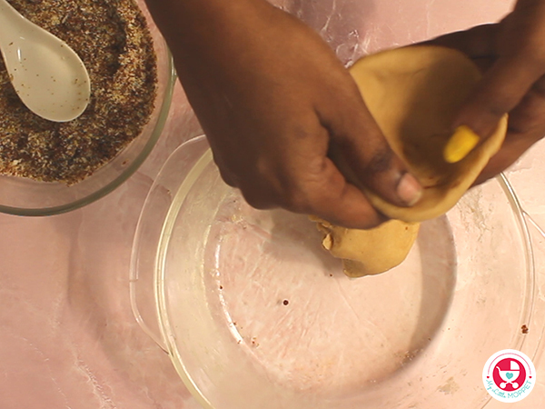 Pinch a small portion of dough and make it into cups.